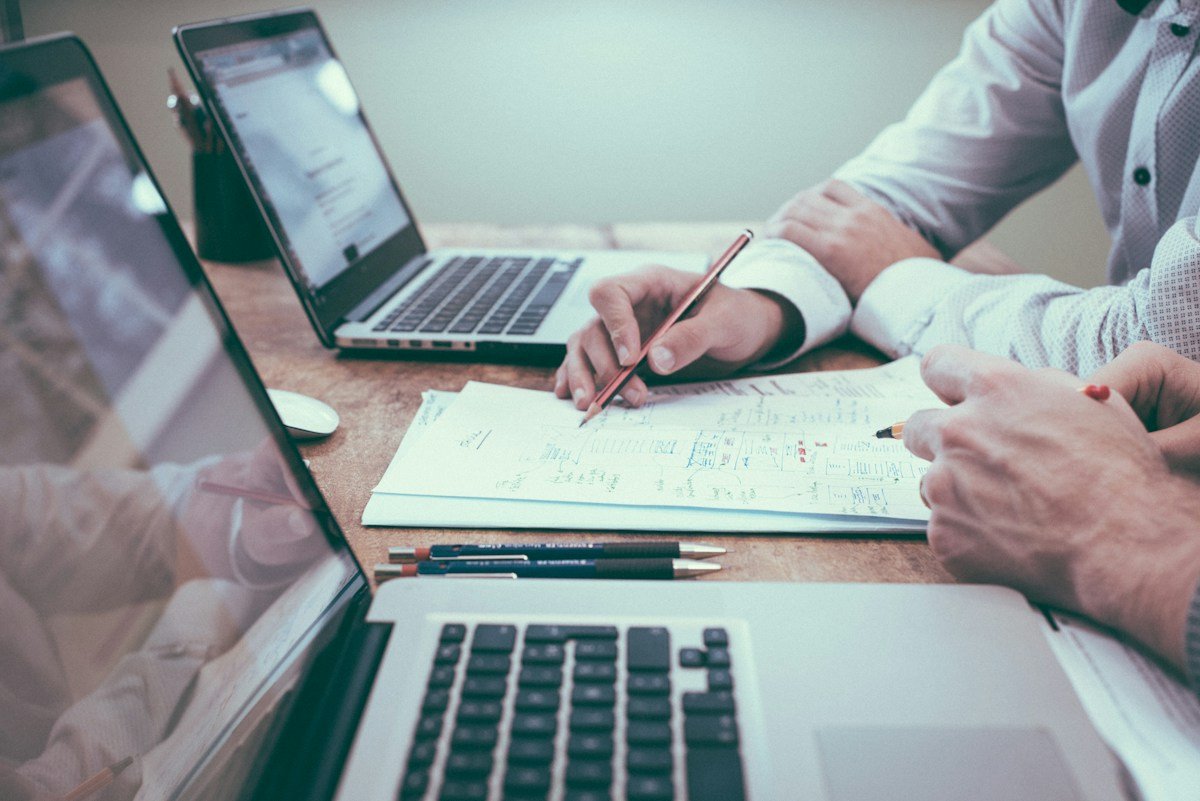 Professionals reviewing business plans