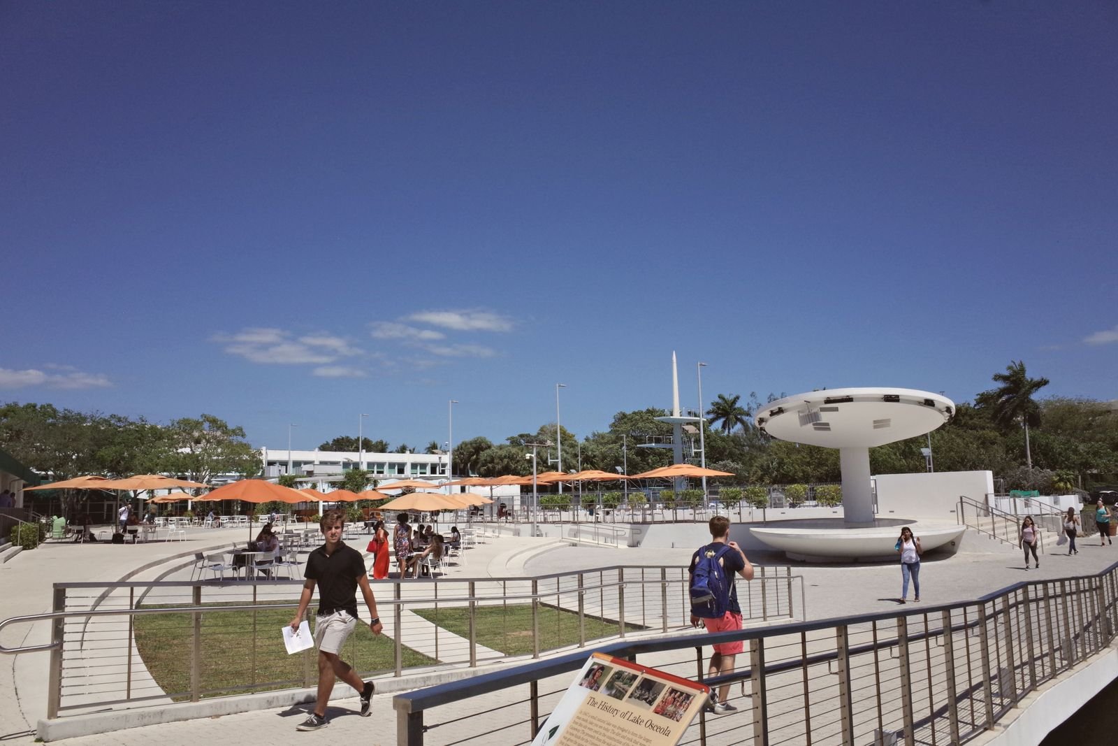 Outdoor campus area at a university in Coral Gables, FL, with students and modern architecture