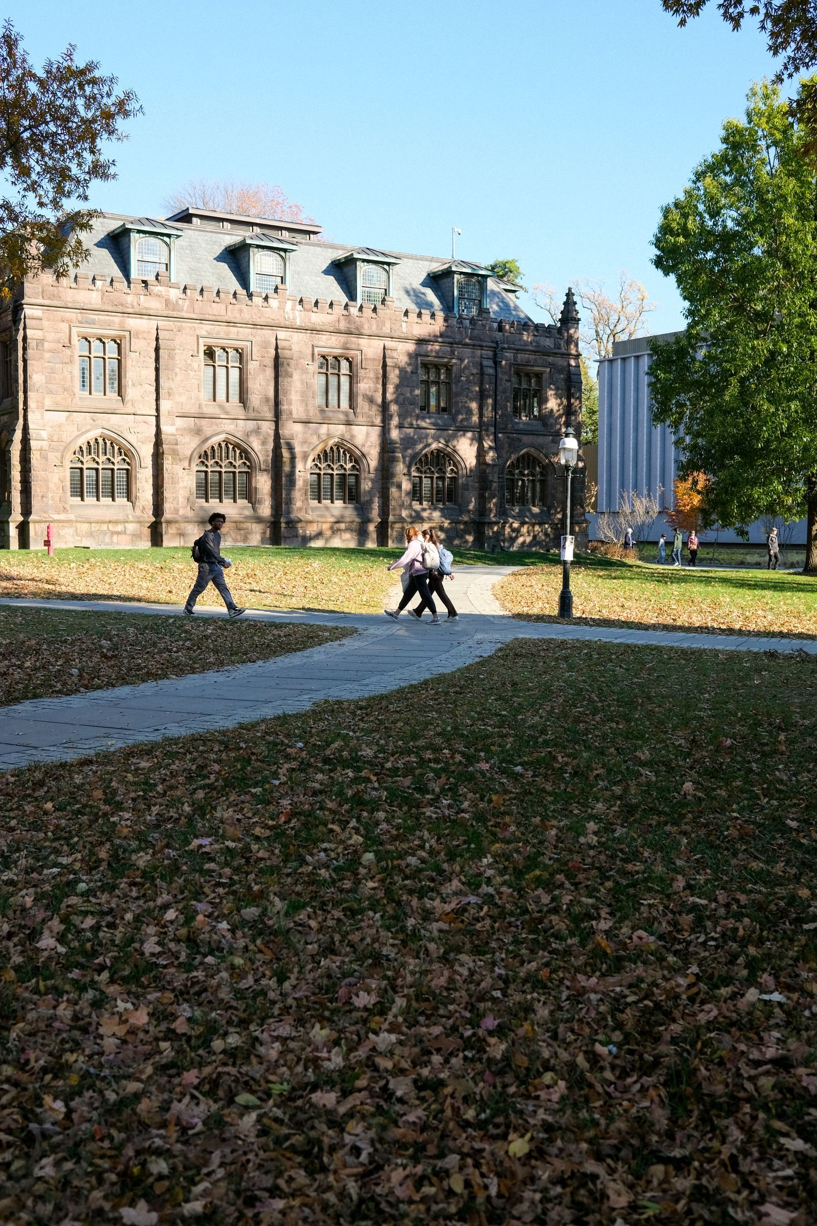 University campus with historic architecture and autumn leaves